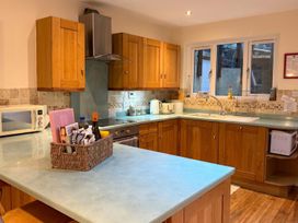 A kitchen with wooden cabinets and a sink at the property