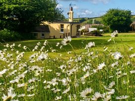A house with flowers in the yard at 