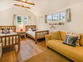 A bedroom with two beds and a sofa at the property in location