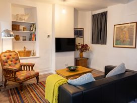 A living room with a sofa and armchair at the property