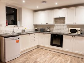 A kitchen with various appliances and cabinets at 