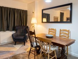 A dining room with a table and chairs at The Old Barn in Manchester