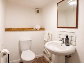 A bathroom with a toilet and sink at The Old Barn in Manchester