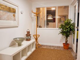 An entryway with a coat stand and a lantern at The Old Barn in Manchester