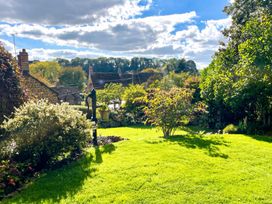 A garden with grass and plants at a property in an unspecified location