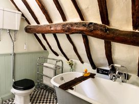 A bathroom with a bathtub and toilet at 