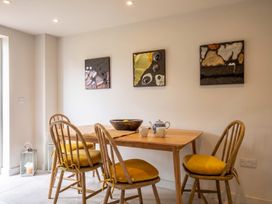 A dining room with a table and chairs at The Old Barn in Manchester