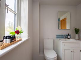 A bathroom with a sink and toilet at 