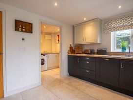 A kitchen with a sink and appliances at The Old Barn in Manchester