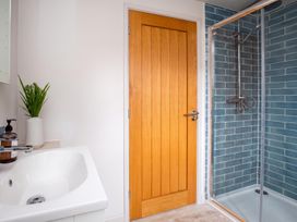 A bathroom with a sink and shower at a property