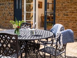 An outdoor dining area with a round table and chairs at 