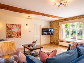A living room with a sofa and coffee table at The Old Barn in Manchester