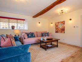 A living room with a coffee table and artwork at the property in location