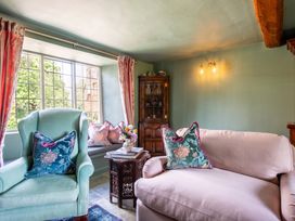 A living room with chairs and a table at an unspecified location