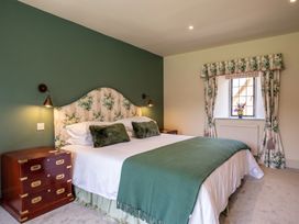 A bedroom with a bed and a window at The Old Barn in Manchester