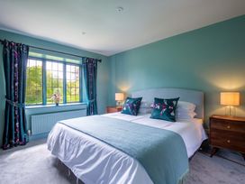 A bedroom with a bed and curtains at the property in the location