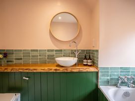 A bathroom with a sink and mirror at the property