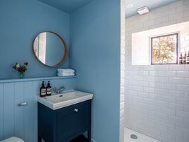 A bathroom with a sink and shower at The Old Barn in Manchester