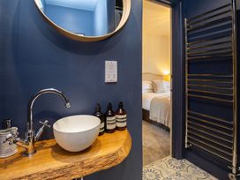 A bathroom with a sink and mirror at an unspecified location