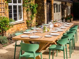 An outdoor dining area with a table set for a meal at 