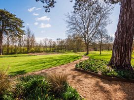 A garden with trees and a path at the property