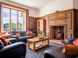 A living room with a fireplace and a chess set at 