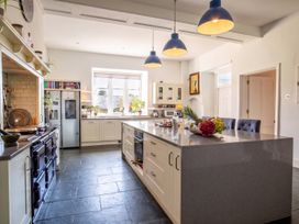 A kitchen with a large island and various appliances at 