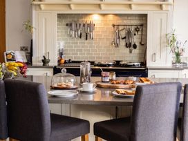 A kitchen countertop with breakfast items at the property