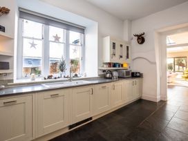 A kitchen with a sink and window at 
