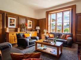 A living room with a sofa and coffee table at The Old Barn in Manchester