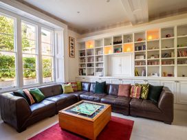 A living room with a sofa and a coffee table at The Old Barn in Manchester