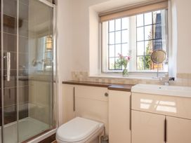 A bathroom with a shower and toilet at The Old Barn in Manchester