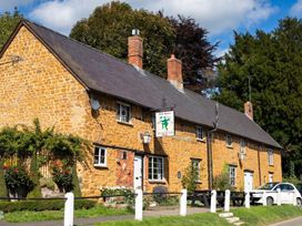 A building with a sign in front at The Green Man in an outdoor setting