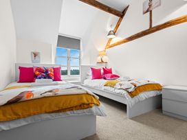 A bedroom with two beds and a window at the property