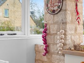 A kitchen with a stone wall and decorative sign at 