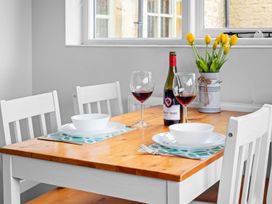 A dining room with a table set for two at The Old Barn in Manchester