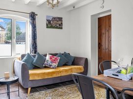 A living room with a sofa and coffee table at The Old Barn in Manchester