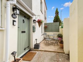 An outdoor area with a table and chairs at 145