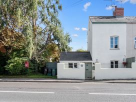 A house with a gate and trees at a property in location