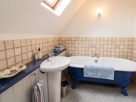 A bathroom with a bathtub and sink at the property