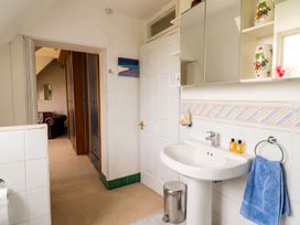 A bathroom with a sink and mirror at The Old Barn in Manchester