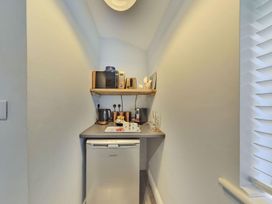 A kitchen with appliances and storage at 