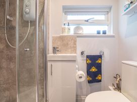 A bathroom with shower and sink at The Old Barn in Manchester