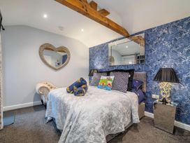 A bedroom with a bed and decorative items at the property