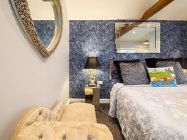 A bedroom with a bed and decorative elements at the property