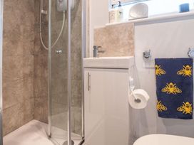 A bathroom with shower, toilet and sink at The Old Barn in Manchester