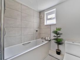 A bathroom with a bathtub and toilet at the property