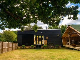 A house with a deck and trees in the garden at the property in the location