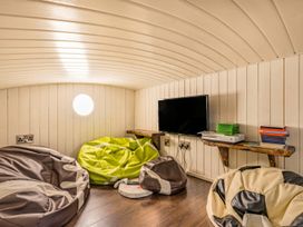 A snug with bean bags and a television at the property