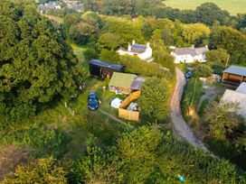 An outdoor view with houses and vehicles at a rural location